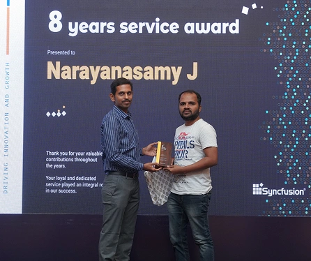 Narayanasamy receving eight years service awards