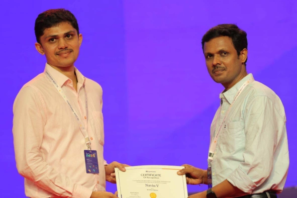Navin Vinayagam Receiving an Award
