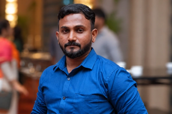 Nijamudeen in blue shirt