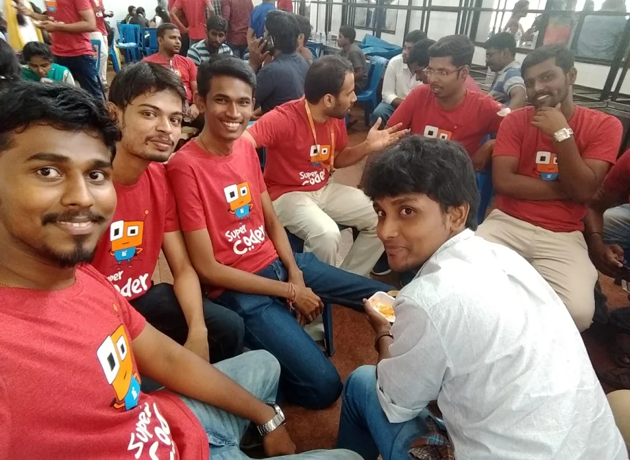 piramanayagam with team sitting in chairs