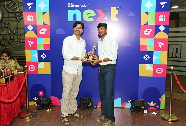 Praveenkumar receiving an award from baskaran