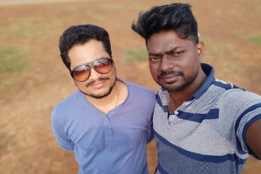 Ravi Kumar Gurunathan with friend outside