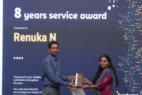 Renuka Nagapooshnam Receiving Eight Years Service Award