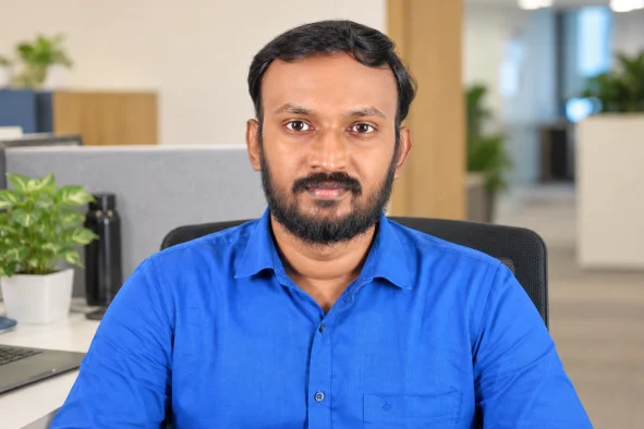 Sabari Anand sitting in office space