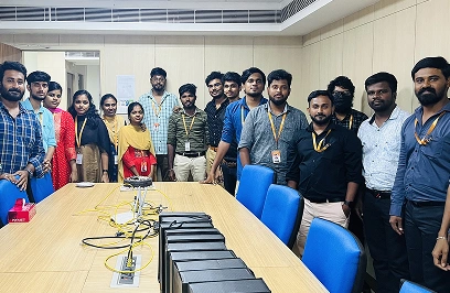 Sasi kumar with team in the conference room