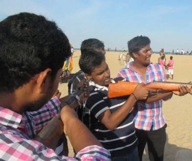 Satheeskumar sekar playing with gun with friends