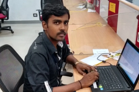 Satheeskumar sekar working in laptop