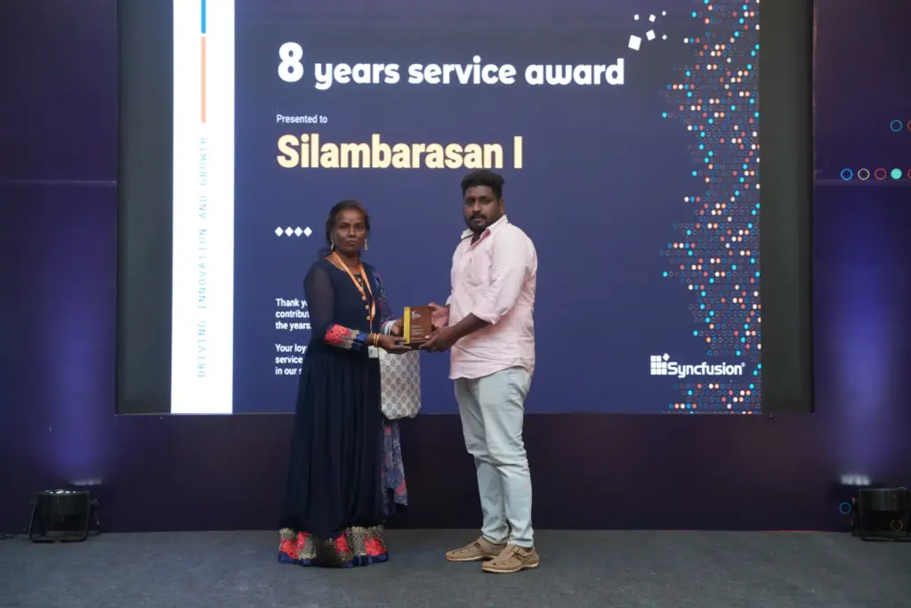 Silambarasan Ilango Receiving Eight Years Service Award