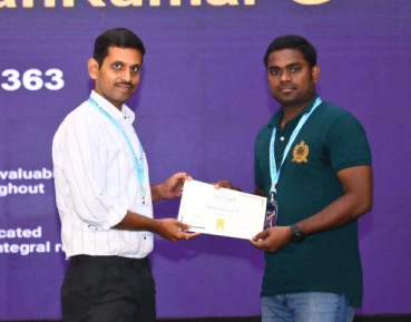Sumankumar Gopalakrishnan Receiving a Certificate