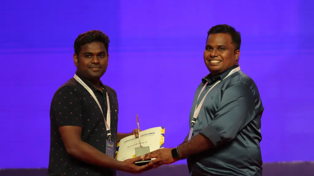 Sumankumar Gopalakrishnan Receiving an Award from Rajendran