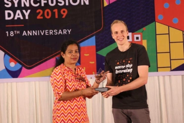 Usha Clementine Henry receiving an award from stephen