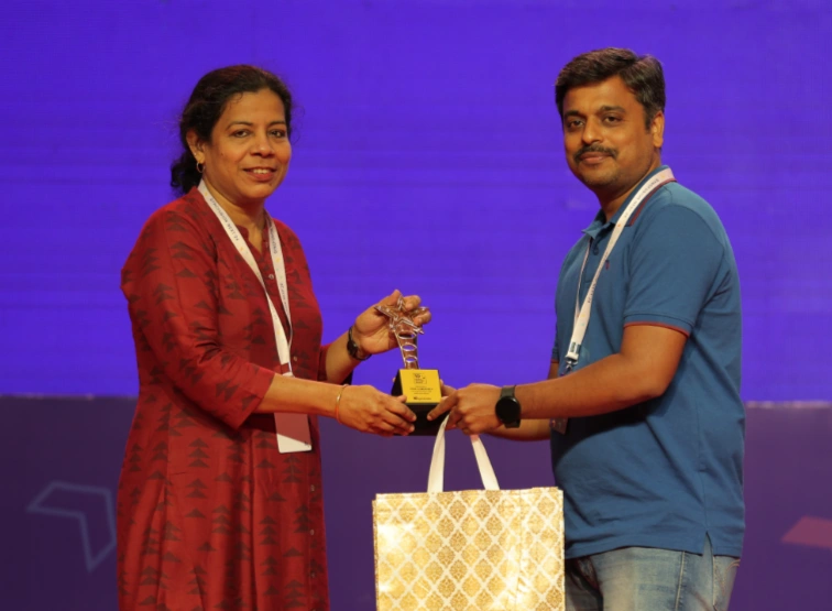 Usha Clementine Henry receiving an award