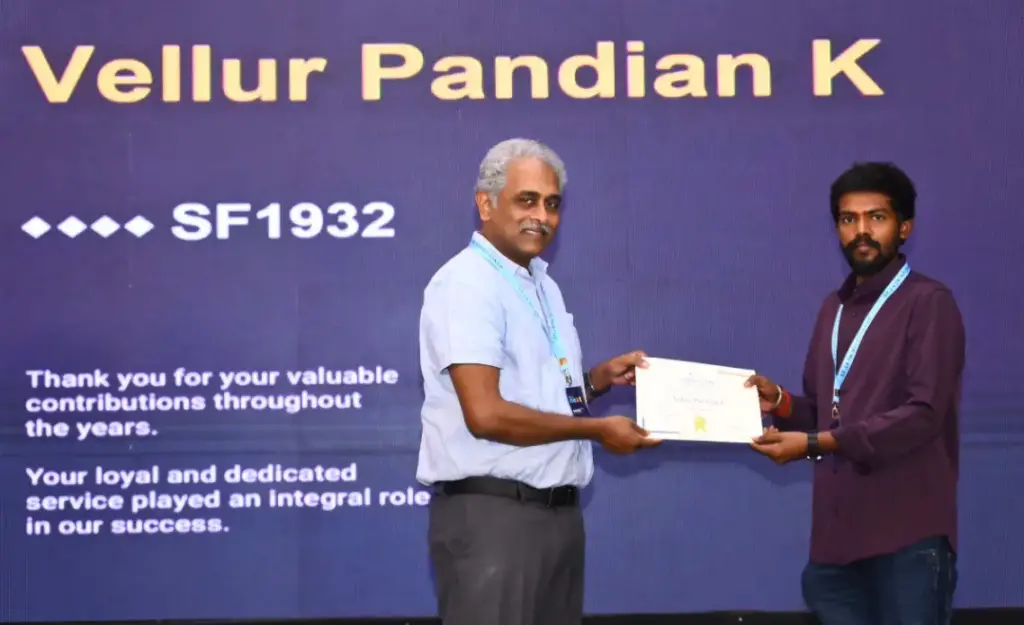 Vellur Pandian Kaliappan Receiving an Award