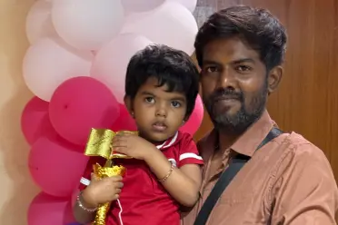 Vellur Pandian Kaliappan with Child