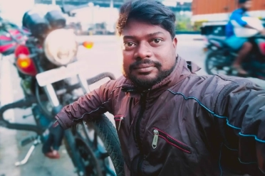 Vijay Raja With Bike Outside
