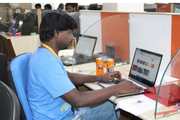 Vijay Raja Working At Desk