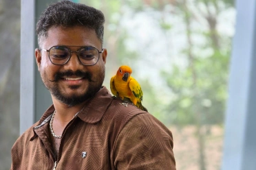 Vijayakumar Mariappan with parrot