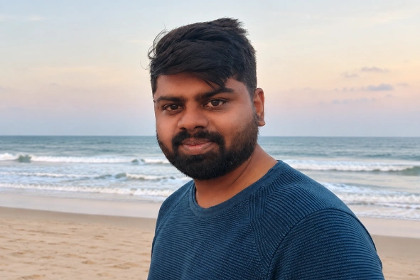 Vijayakumar Yoganandan standing in beach