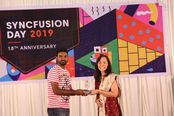 Vinoth Krishnamoorthy Receiving Award At Anniversary Event