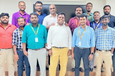 Vinoth Krishnamoorthy With Team Members in Office