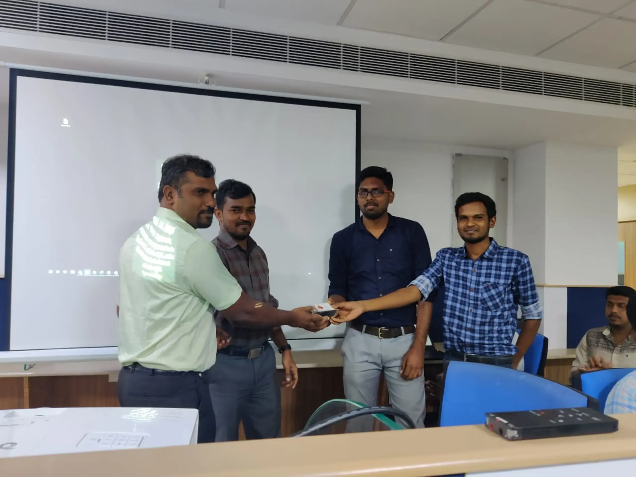 Vinoth srinivasan receiving gift from balaji and lingaraj