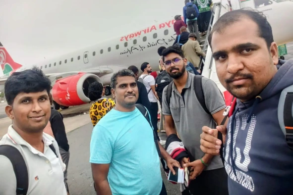 Vinoth srinivasan with team near flight