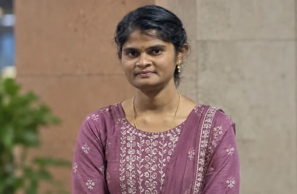 Suriya Murugan standing in the office space